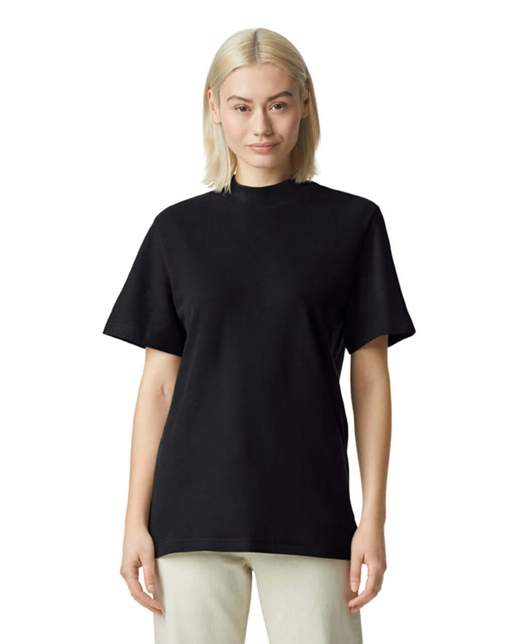 Model wearing American Apparel Pique Unisex Mockneck T-Shirt in black, showcasing comfort and style.