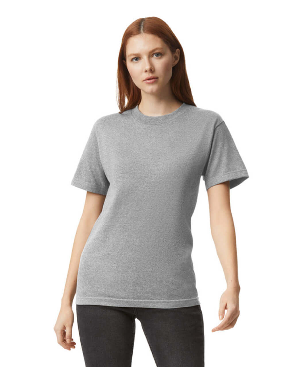 Model wearing a heather grey unisex heavyweight cotton t-shirt, showcasing its versatility and style.