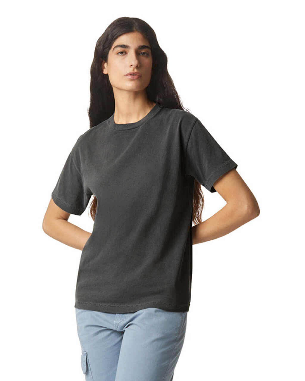 Model wearing AMERICAN APPAREL heavyweight cotton unisex garment dyed tee in black, showcasing luxury and comfort.