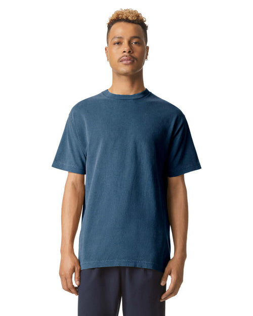 Model wearing AMERICAN APPAREL heavyweight cotton unisex garment dyed tee in blue, showcasing luxury and comfort.