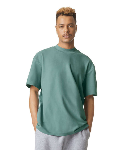 Model wearing American Apparel Pique Unisex Mockneck T-Shirt in arctic, showcasing comfort and style.