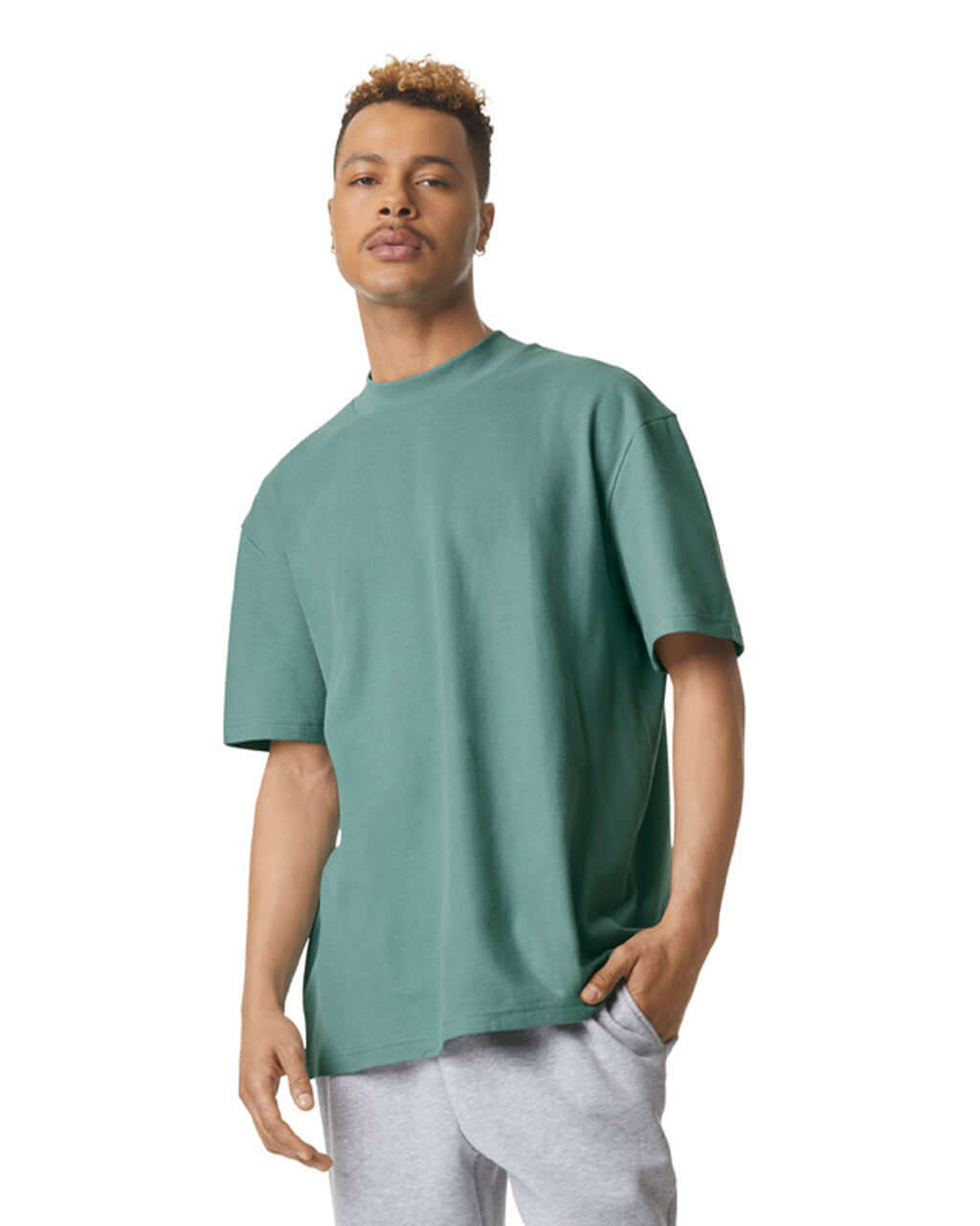 Model wearing American Apparel Pique Unisex Mockneck T-Shirt in arctic, showcasing comfort and style.