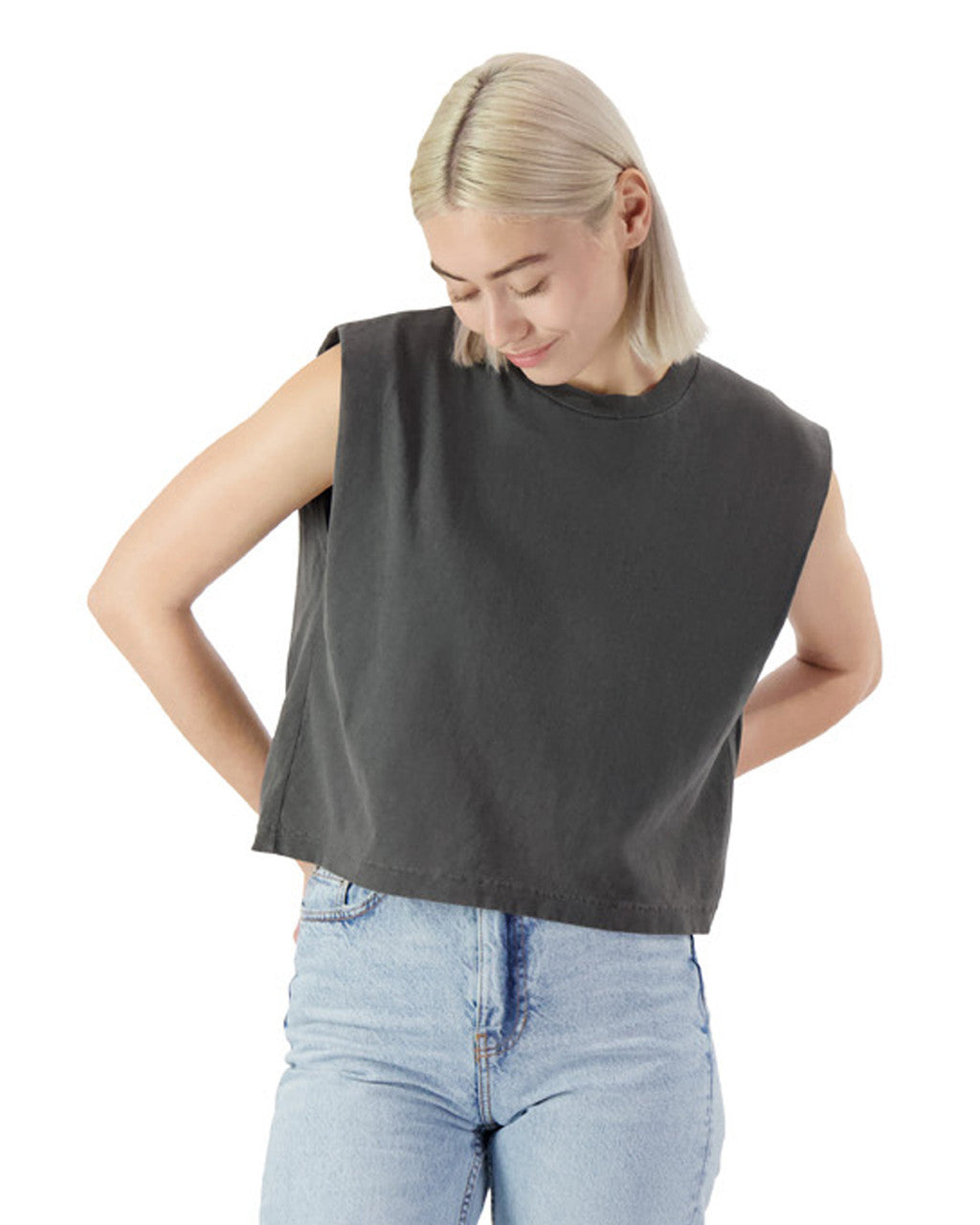 Model wearing the American Apparel heavyweight garment dyed muscle t-shirt in dark grey, styled with light denim jeans.