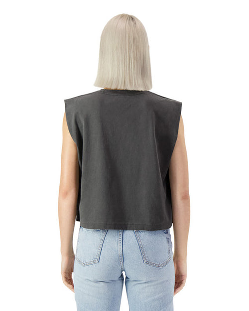 Back view of a model wearing a black heavyweight muscle t-shirt with light blue jeans.