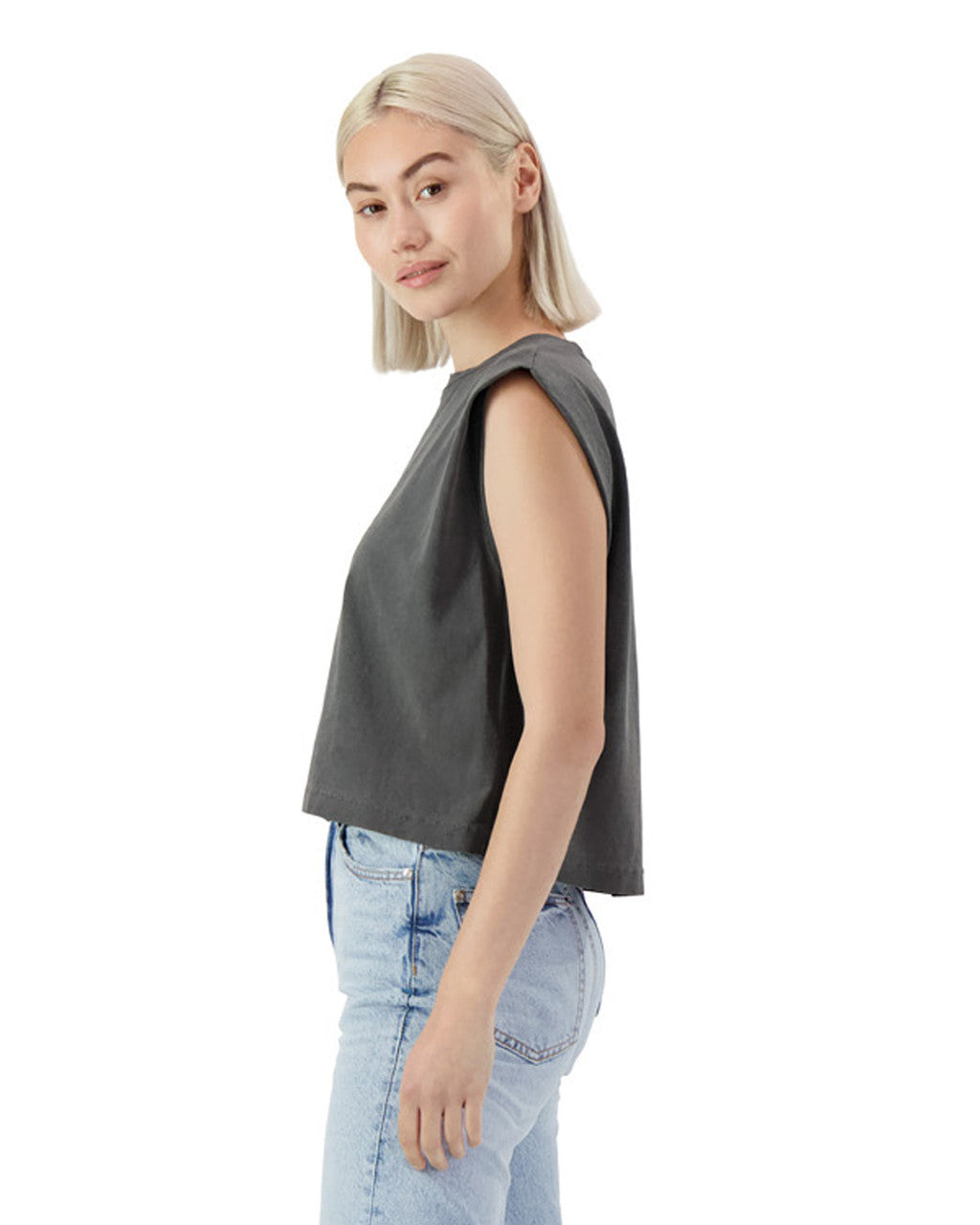 Side view of a model wearing an AMERICAN APPAREL heavyweight garment dyed muscle t-shirt in grey.