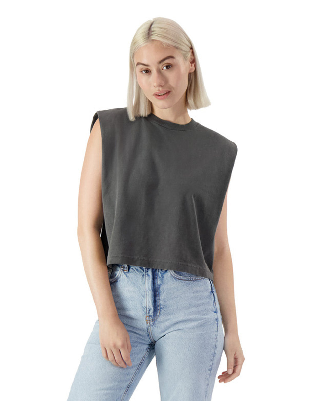 Model wearing AMERICAN APPAREL HEAVYWEIGHT GARMENT DYED MUSCLE T-SHIRT in charcoal gray with casual jeans.