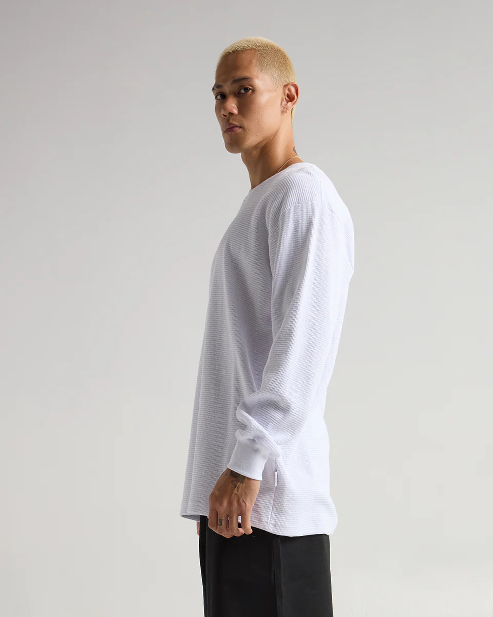 Model showcasing SHAKA WEAR Heavyweight Thermal in white, highlighting warmth and breathability.