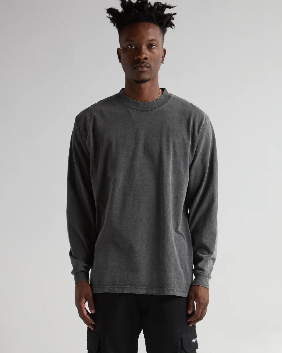 Model wearing MAX HEAVYWEIGHT GARMENT DYE LONG SLEEVE in grey, showcasing premium streetwear style and durability.